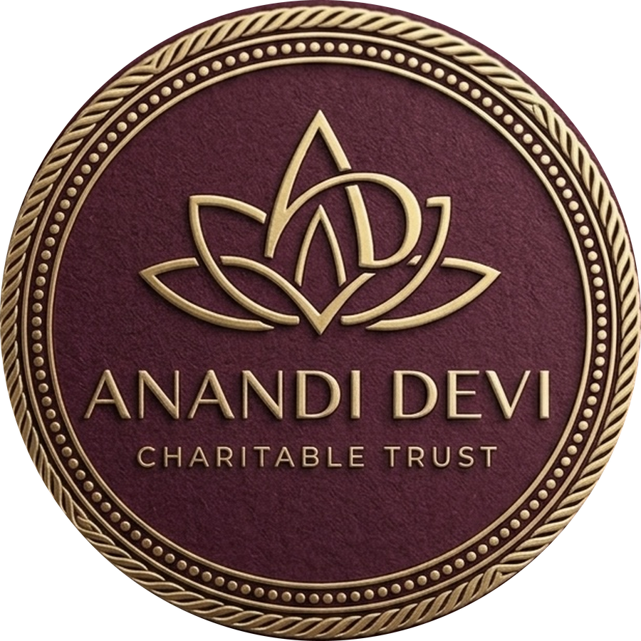 The Anandi Devi Trust emblem — a lotus enclosing the initials A and D